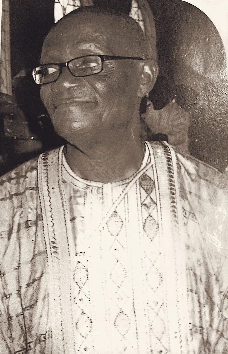 Papa Elkanah Osibanjo in indigo adire agbada.